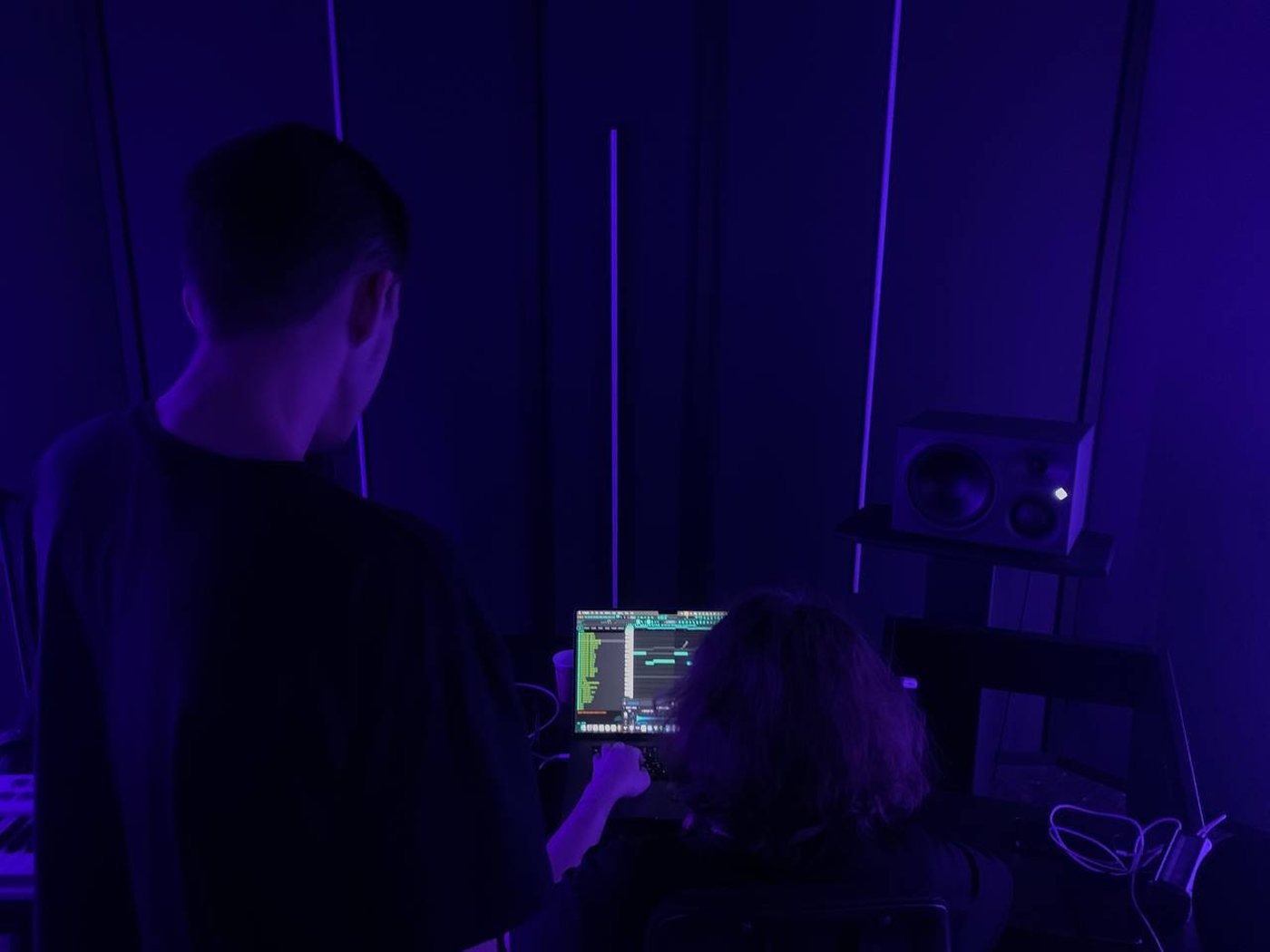 akira and speenzy working in the studio